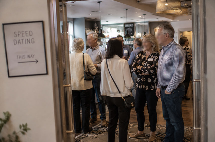 Guests arriving for a speed dating event